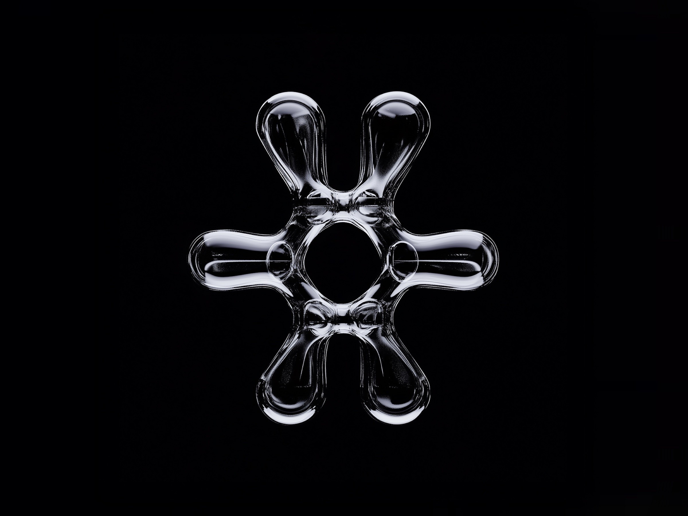 Une forme en métal liquide brillant sur fond noir.